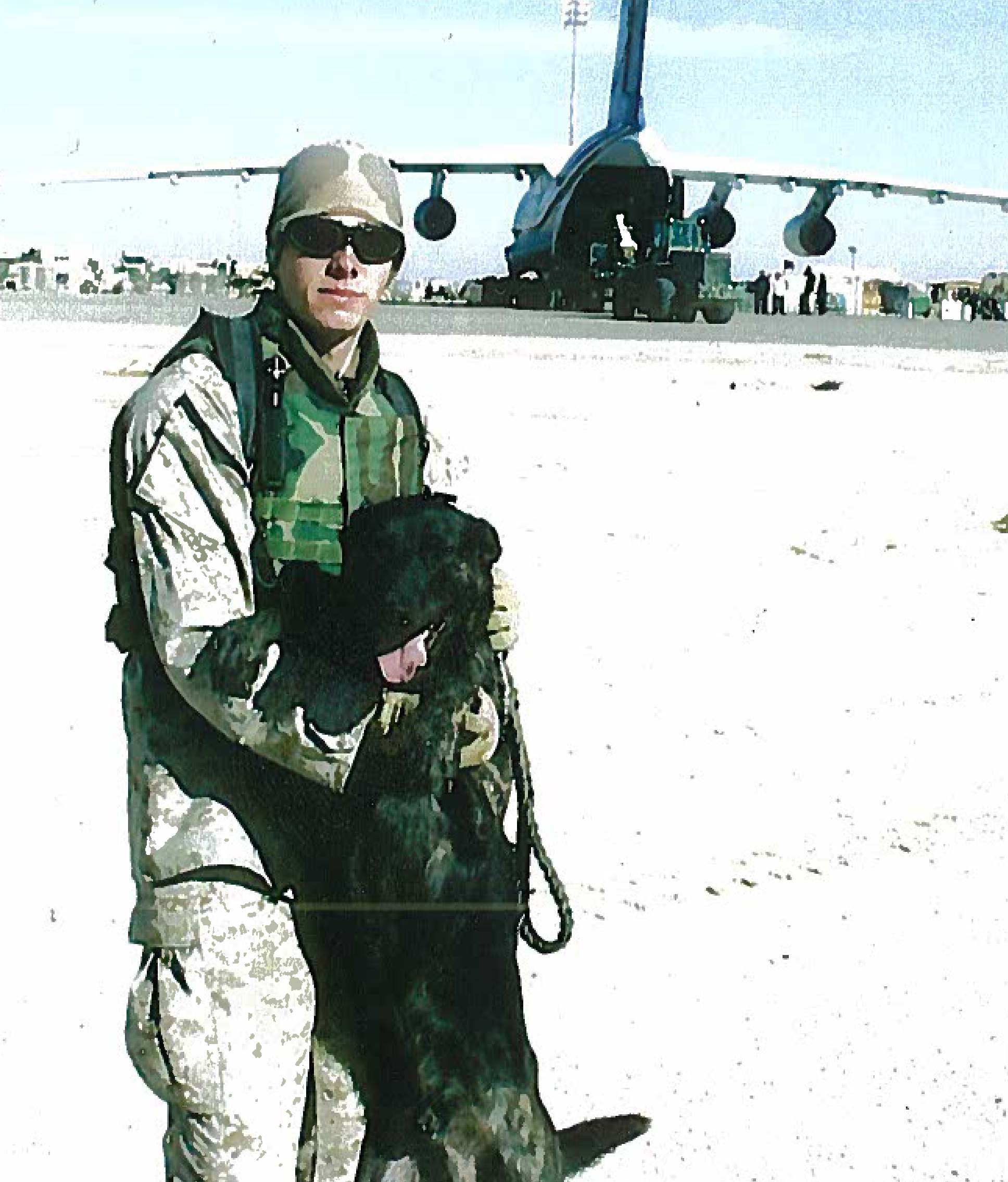 Chris completing his first combat deployment in 2004 with MWD Marco F281. Photo taken at Al Asad Iraq.
